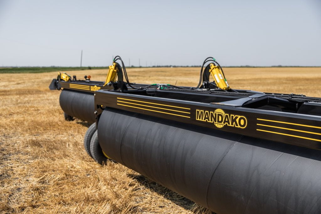 What are the advantages of using land rollers in agricultural practices?