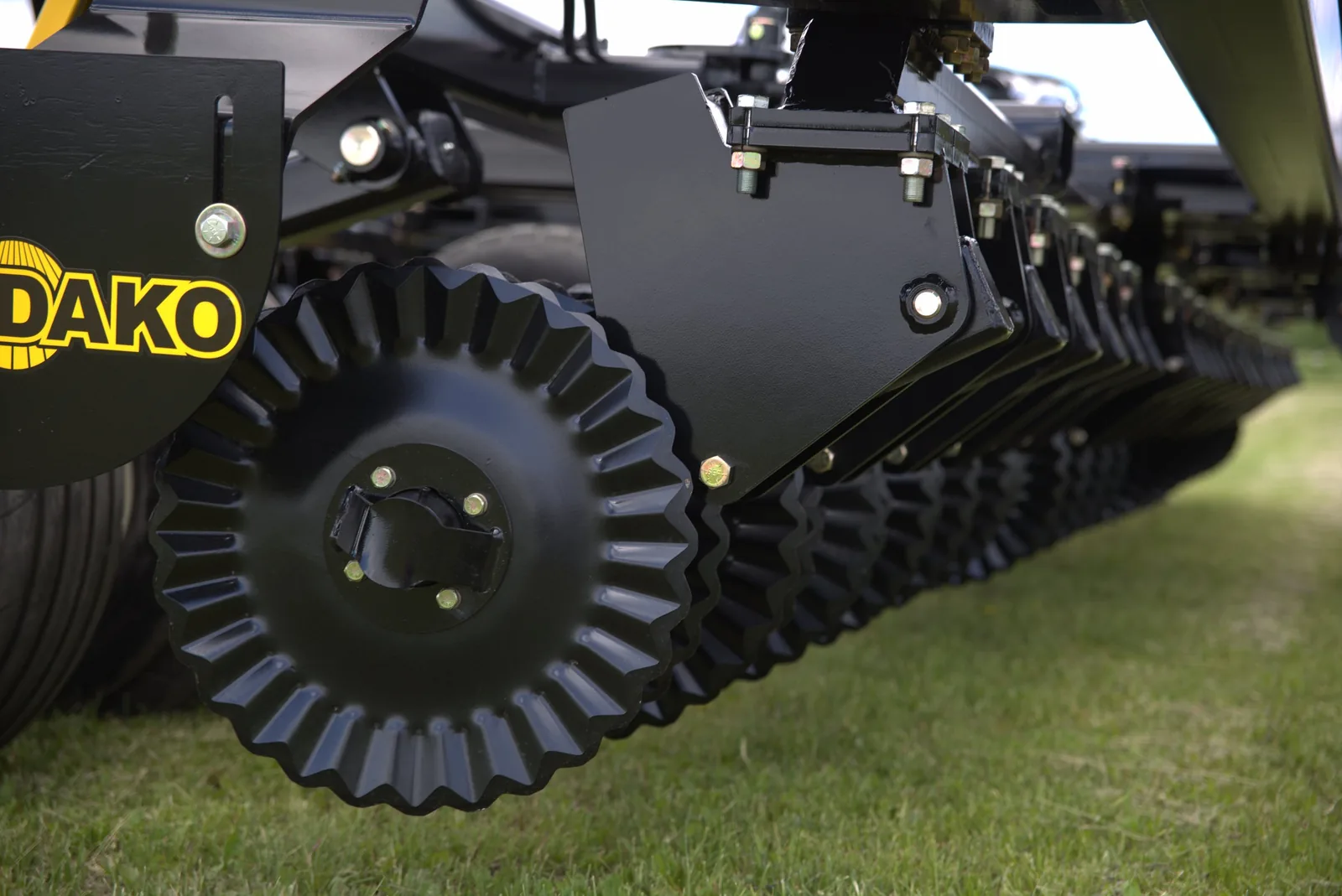 Close-up of black packer wheels and frame structure on Mandako Storm